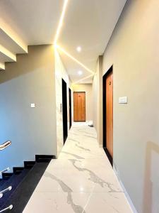 a corridor of a building with a hallway at Hotel Golden Glory Scheme 103 in Indore