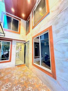 a building with windows and a tiled floor at Hotel Golden Glory Scheme 103 in Indore