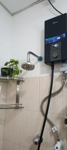 a computer monitor on a counter in a kitchen at Apartment no17 in Galle