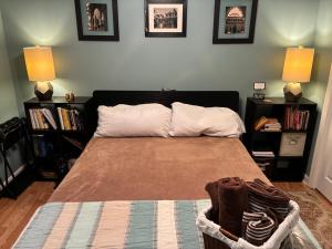 a bedroom with a bed with two bookshelves at Lakefront Serenity in Marietta