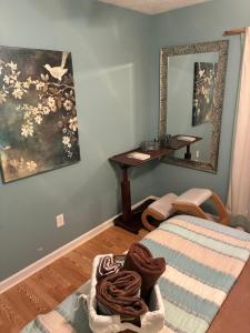 a room with a bed and a table with a mirror at Lakefront Serenity in Marietta +5 photos