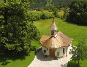 an aerial view of a small building with a roof at Gasthof Bad Hochmoos in Lofer