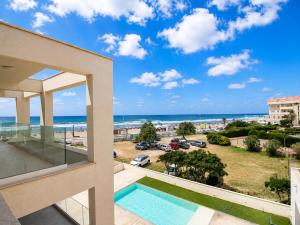 a view of the beach from the balcony of a house at Sea & Pool Apartment in Casa Santa