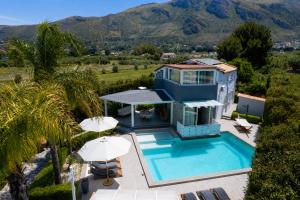 an aerial view of a house with a swimming pool at Moresca Luxury Private Villa & Spa in Castellammare del Golfo