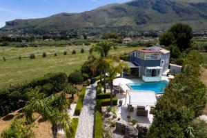 an aerial view of a house with a swimming pool at Moresca Luxury Private Villa & Spa in Castellammare del Golfo