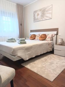 a bedroom with a bed with pillows and a window at Cristine's House in Marino