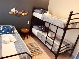 a bunk bed room with two bunk beds in it at MARSOL RELAX Roda de Barà in Roda de Bará