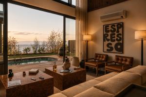 a living room with a couch and a table at Voger Sapanca Lake View in Sapanca