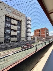 a view of a building from a train station at Apartamento de 2 Quartos no Centro in Imperatriz