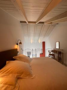 a large bed in a room with a table and chairs at Pirrion Villas in Ano Pedina