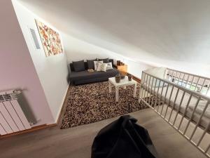 a living room with a couch and a table at Casa Encosta da Caniçada in Vieira do Minho +16 photos