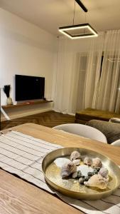 a bowl of mushrooms on a table in a living room at Mar'al Mar Luxury Escape in Himare