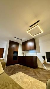 a room with a kitchen with a couch and a sink at Mar'al Mar Luxury Escape in Himare