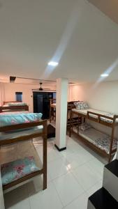 a room with several bunk beds in it at Casa ampla em belém in Belém