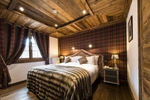 Postel nebo postele na pokoji v ubytování Le Chalet Blanc