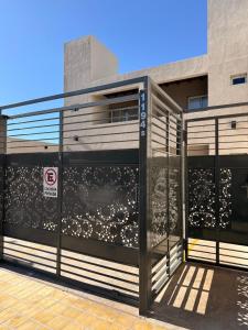 an entrance to a building with a no parking sign at Apart Zona Paula in San Juan