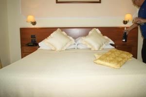 Postelja oz. postelje v sobi nastanitve Hotel Elio