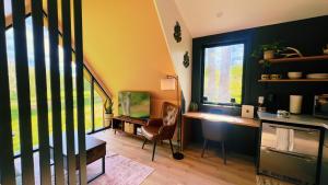a room with a desk and a chair and a window at Bison Farm - Cabin "Loma" in Culpeper +17 photos