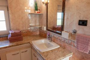 a bathroom with a sink and a mirror at Apartman Ika Umag in Umag +36 photos