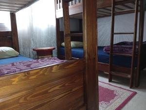 a room with two bunk beds and a doorway at Stars Hostel Tangier in Tangier