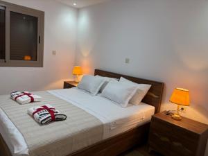 a bedroom with a bed with two towels on it at Marinamer 1 in Saïdia +88 photos
