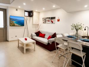 a living room with a couch and a table at BASSA MAREA in Gaeta