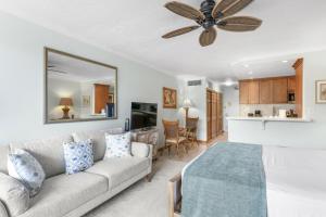 a living room with a couch and a ceiling fan at Lahaina Shores #532 in Lahaina