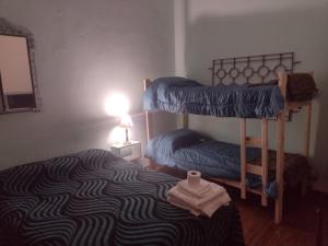 a bedroom with two bunk beds in a room at hotel tango club in Buenos Aires