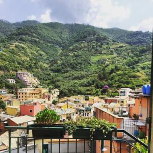 a view of a city with a mountain at La Casa di Andrea Relais in Monterosso al Mare