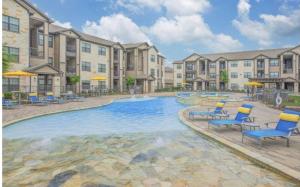 an image of a swimming pool at a apartment complex at Humble cozy home in Humble