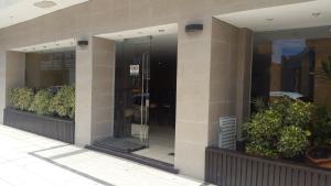 an entrance to a building with a revolving door at Gran Continente Santa Teresita in Santa Teresita