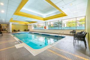 a large swimming pool in a building at Allure Hotel & Conference Center in Barrie