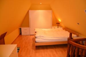 Een bed of bedden in een kamer bij PS Orion