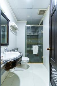 a bathroom with a sink and a toilet at Royal Dalat Hotel in Da Lat +38 photos