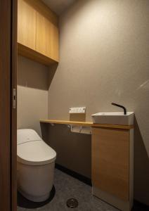 a bathroom with a toilet and a sink at Tousumi in Fukuoka