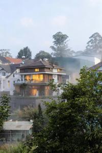 a house on fire with smoke coming out of it at La Lapine Villa -6rooms-15Pax in Khu Chi Lăng