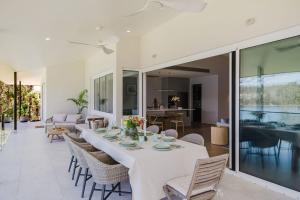 a dining room with a table and chairs at Lakeside House - Waterfront, Spacious, Pool Table in Yatte Yattah