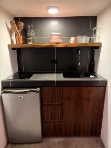 a kitchen with a sink and a counter top at Departamento completo casarosa in Valladolid