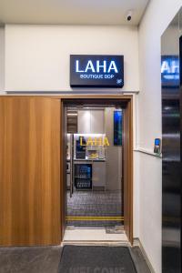 an entrance to a store with a sign over the door at LAHA Boutique DDP Dongdaemun in Seoul