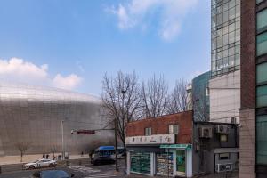 an old building in the middle of a city at LAHA Boutique DDP Dongdaemun in Seoul