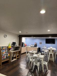 a waiting area with tables and chairs in a store at Athena Inn Chattanooga in Tyner
