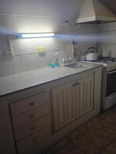 a kitchen with a sink and a stove at Valdez Resi in Santa Rosa
