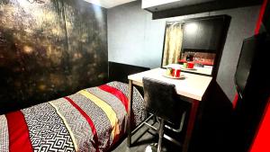 a bedroom with a bed and a desk with a table at Luxury KIA Room E in Richmond Hill