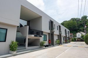 a row of apartments with balconies on a building at The Regent Studio Kamala in Kamala Beach