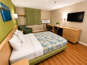 a hotel room with a bed and a desk at Motel 6 Morehead, KY in Morehead