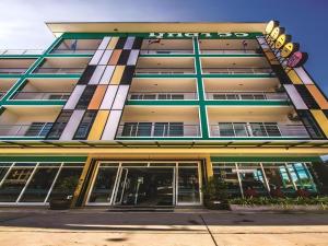 a building with a sign on the front of it at Mukdaview Hotel in Mukdahan