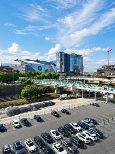 a parking lot with a bunch of parked cars at Sapphire Loft Midtown in Atlanta