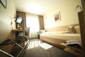 Postel nebo postele na pokoji v ubytování City Partner Hotel Berliner Hof