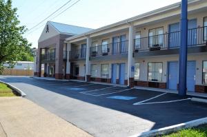 an empty parking lot in front of a building at Athena Inn Chattanooga in Tyner