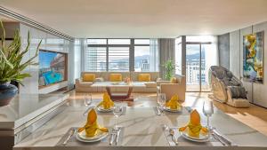 a living room with a couch and a table at PANAMA Nha Trang Hotel in Nha Trang